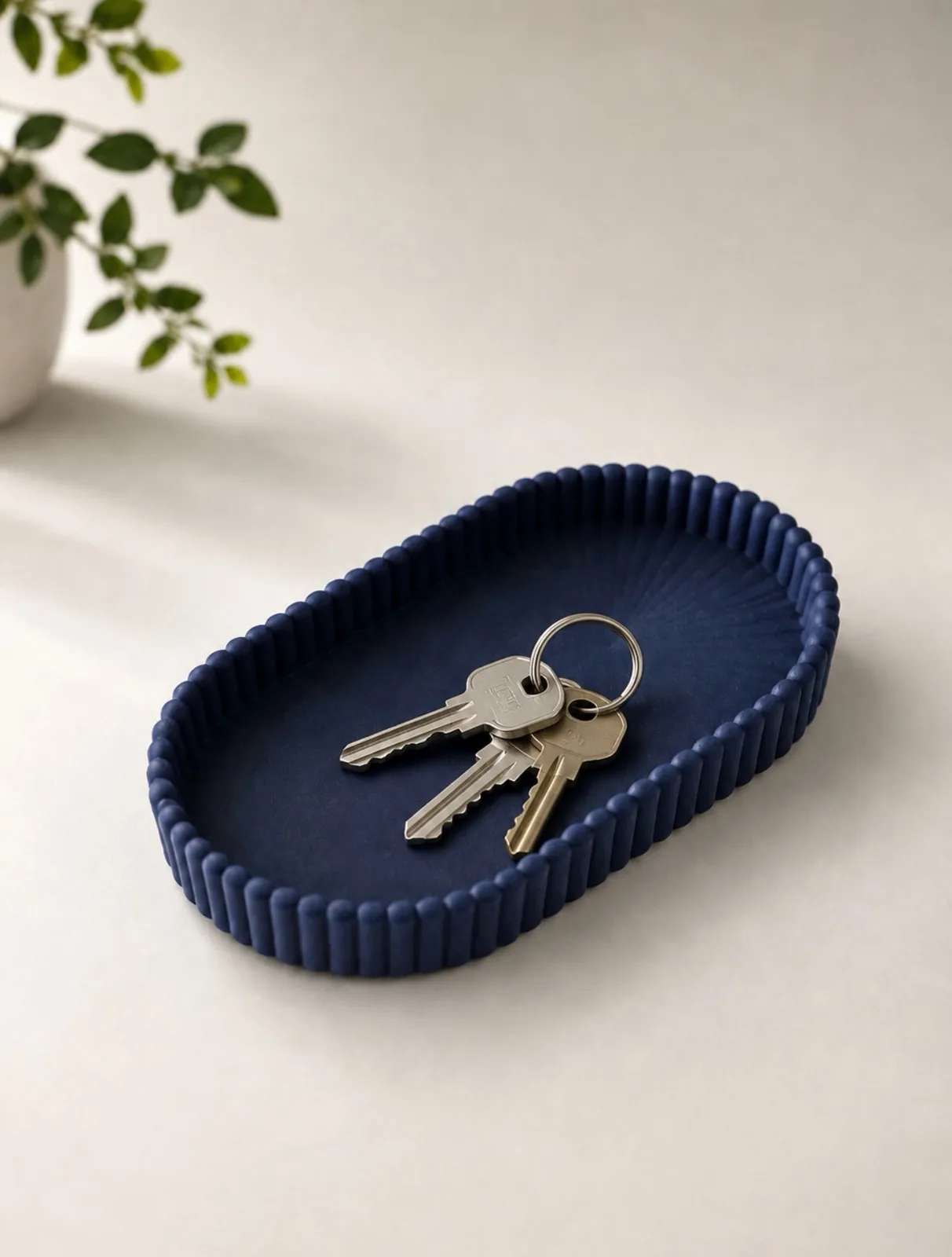 Saddle-stitched style key tray holding small everyday essentials