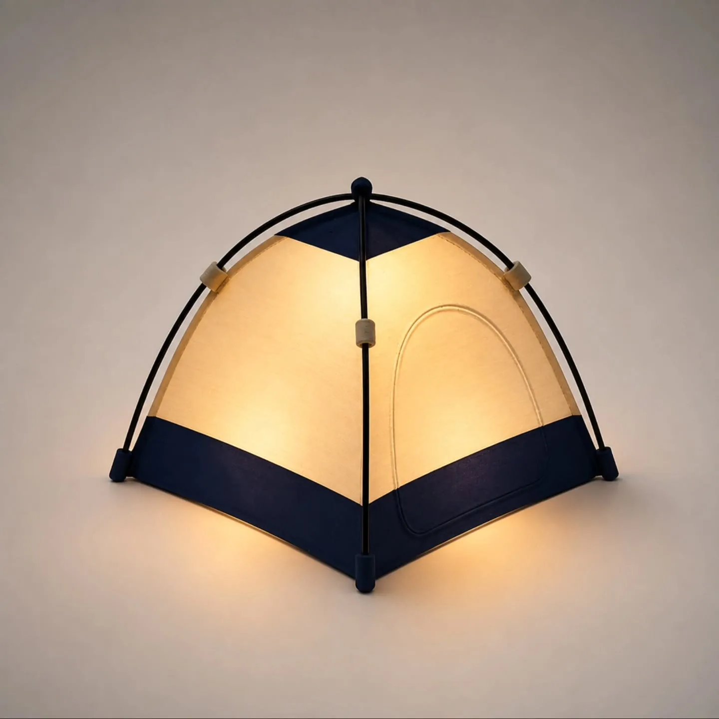 Tent-shaped decorative lamp glowing warmly in a cozy room